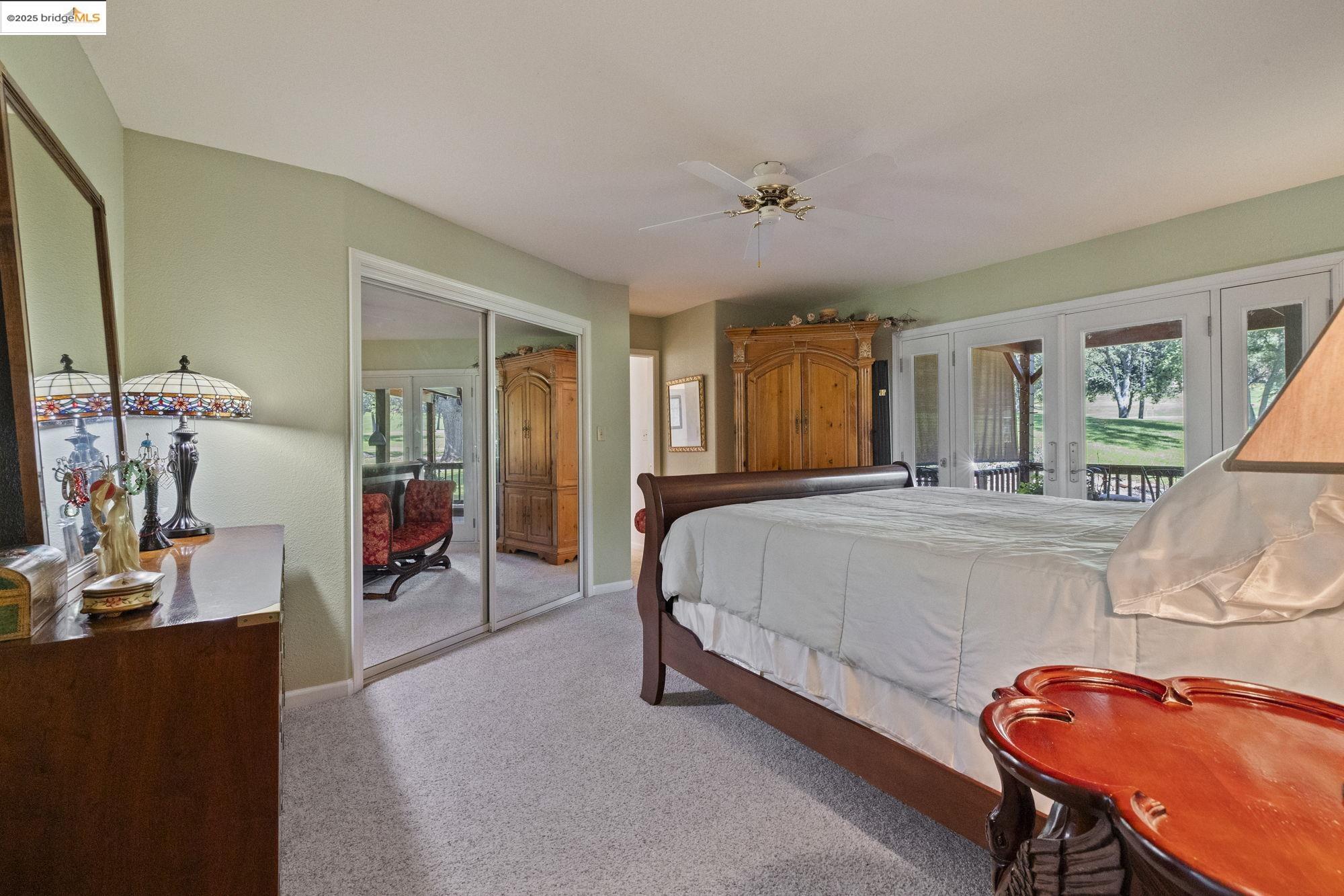 19400 Reid Circle Groveland, CA 95321 - Photo 38 of 60 a spacious bedroom with a bed and wooden floor