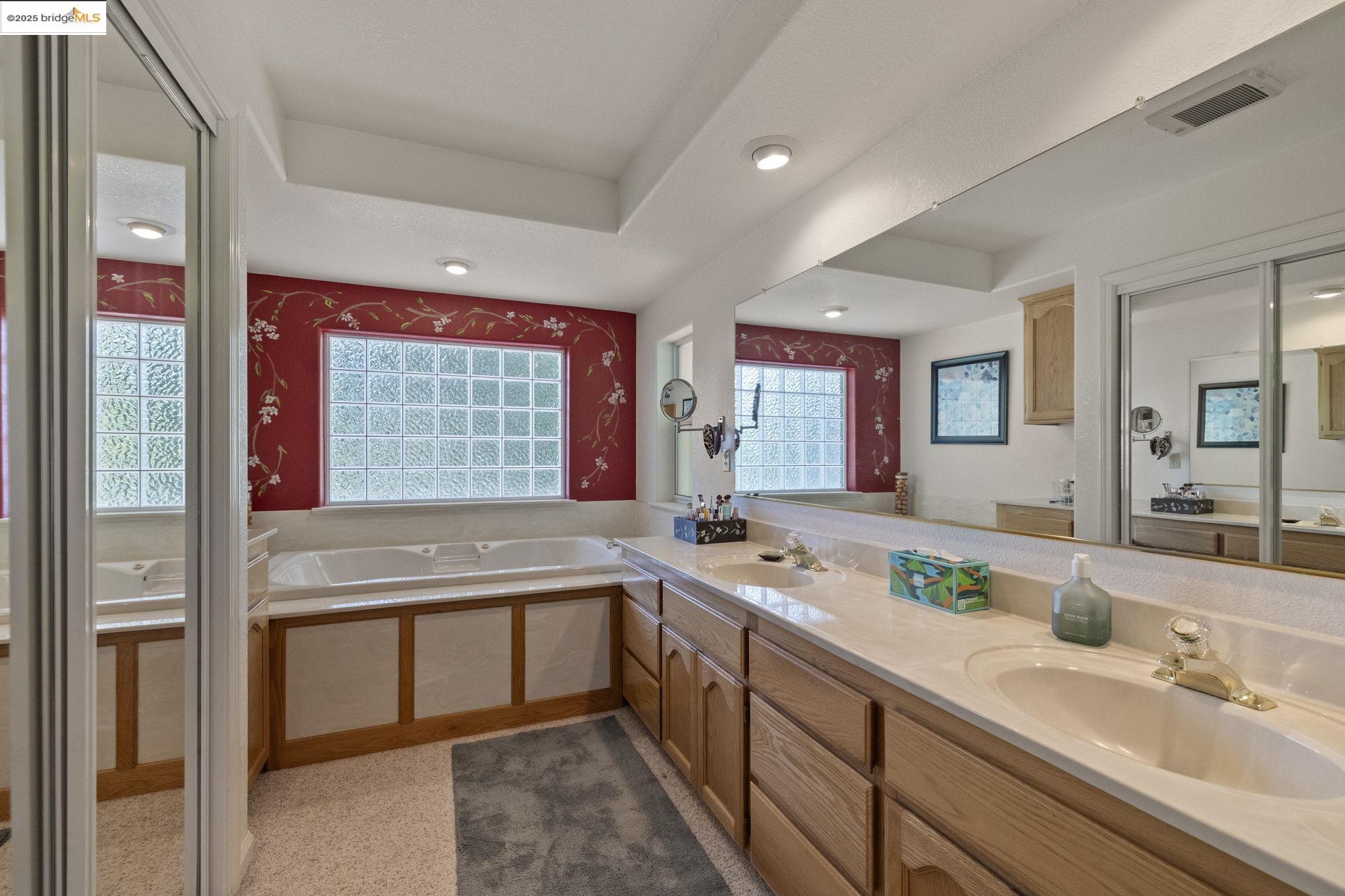 19400 Reid Circle Groveland, CA 95321 - Photo 39 of 60 a bathroom with a granite countertop sink and a large mirror