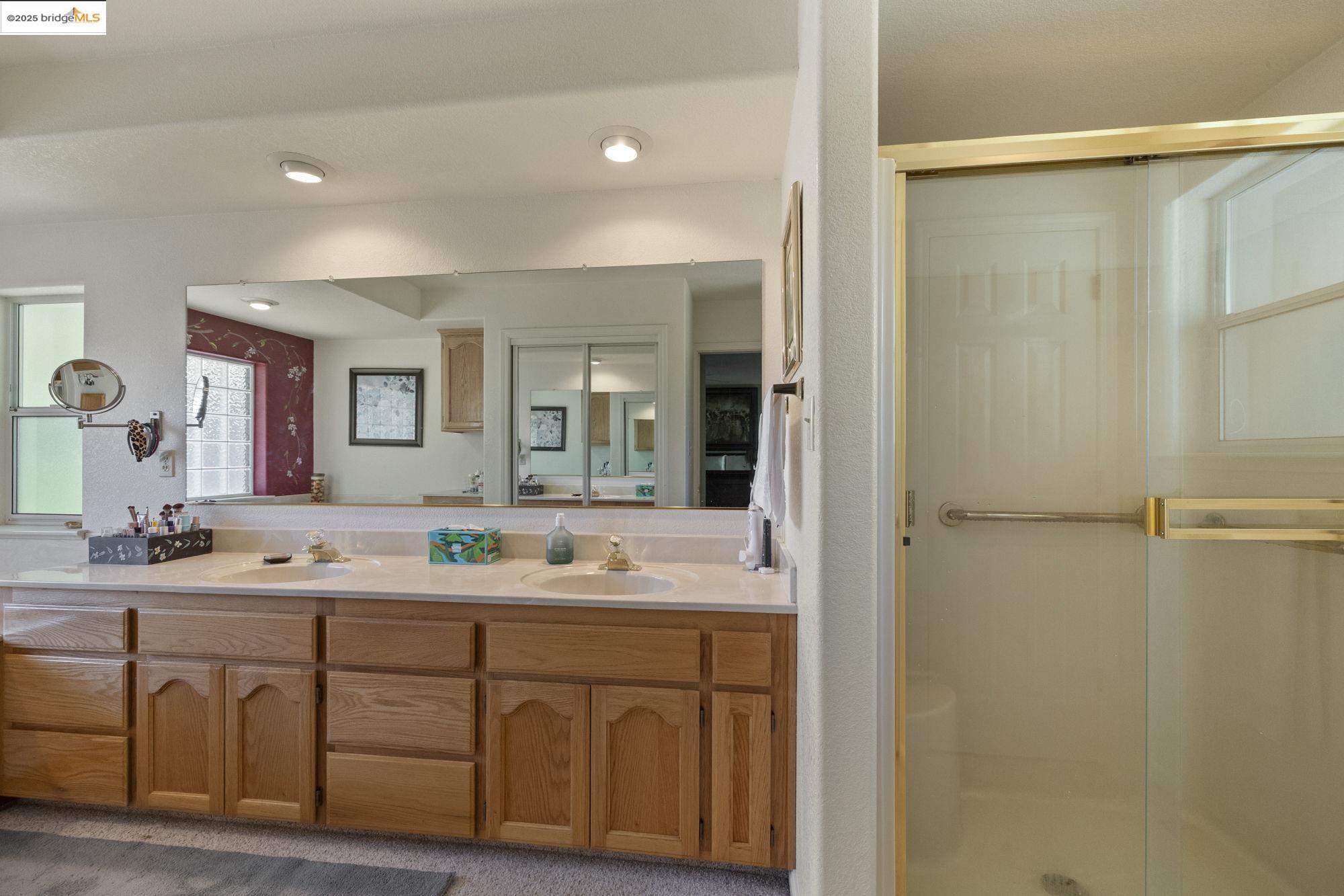 19400 Reid Circle Groveland, CA 95321 - Photo 40 of 60 a bathroom with a double vanity sink mirror and double