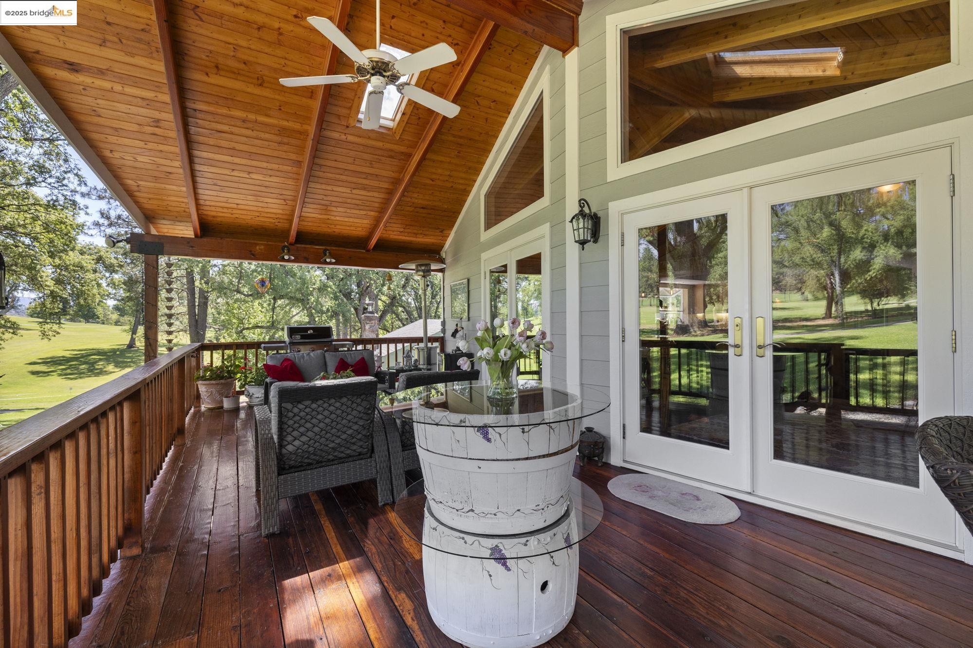 19400 Reid Circle Groveland, CA 95321 - Photo 4 of 60 a view of a porch with furniture and wooden floor
