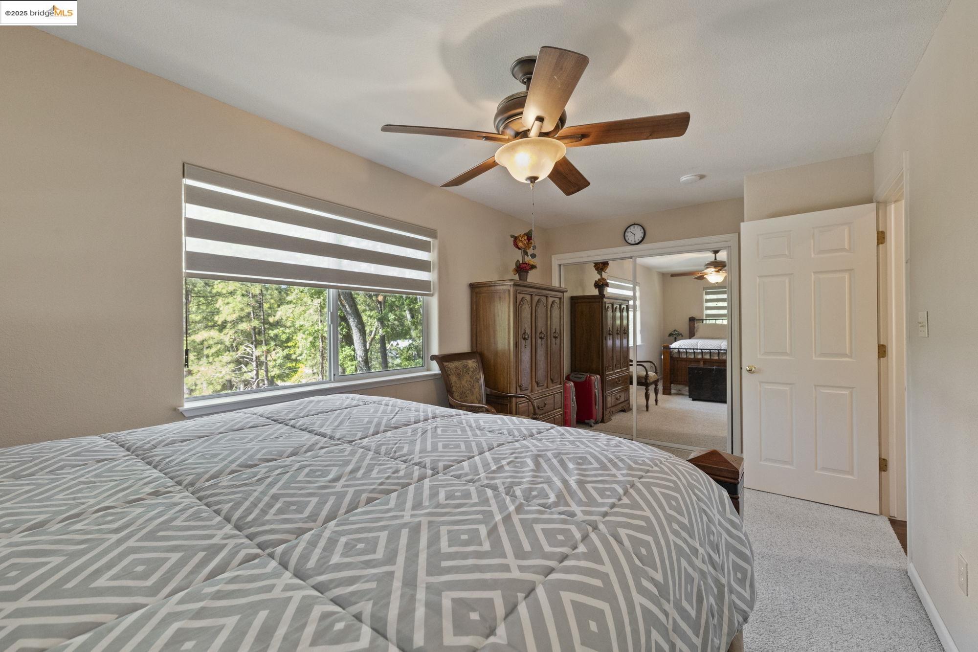 19400 Reid Circle Groveland, CA 95321 - Photo 43 of 60 a bed room with a bed and a large window