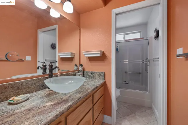 a view of a lush green hillside and houses