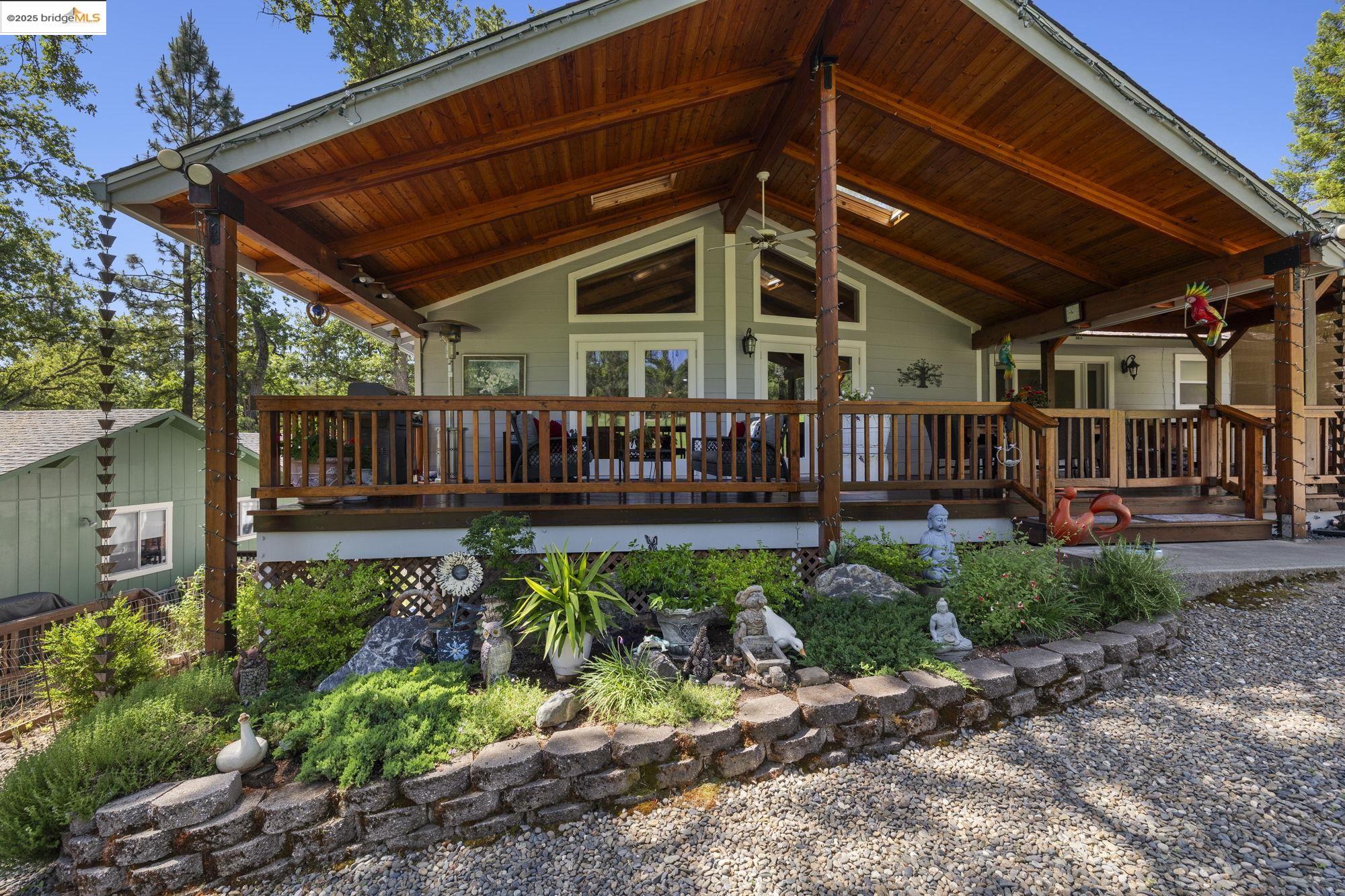 19400 Reid Circle Groveland, CA 95321 - Photo 6 of 60 a view of a backyard with plants and a patio