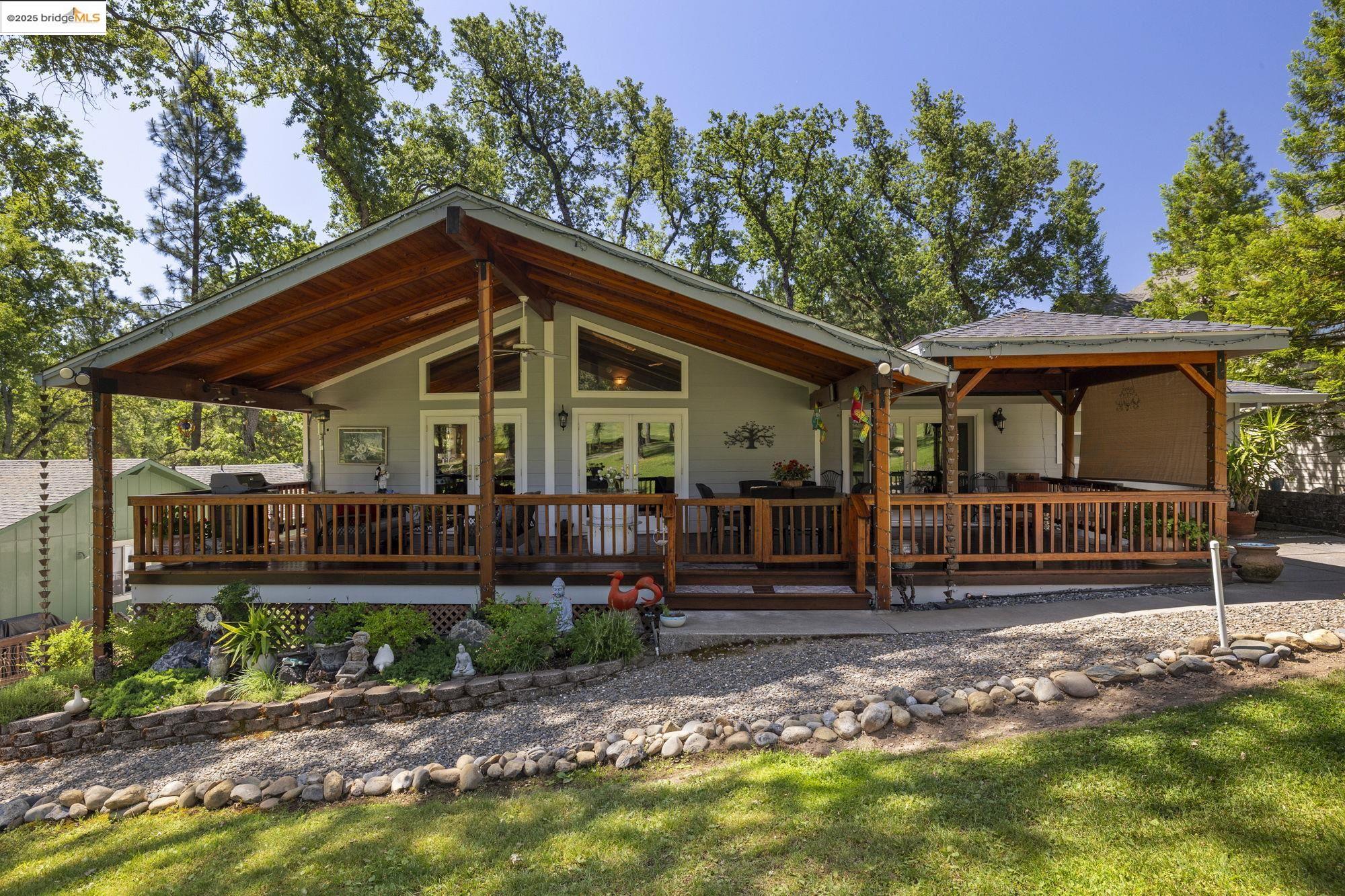 19400 Reid Circle Groveland, CA 95321 - Photo 7 of 60 a front view of a house with garden