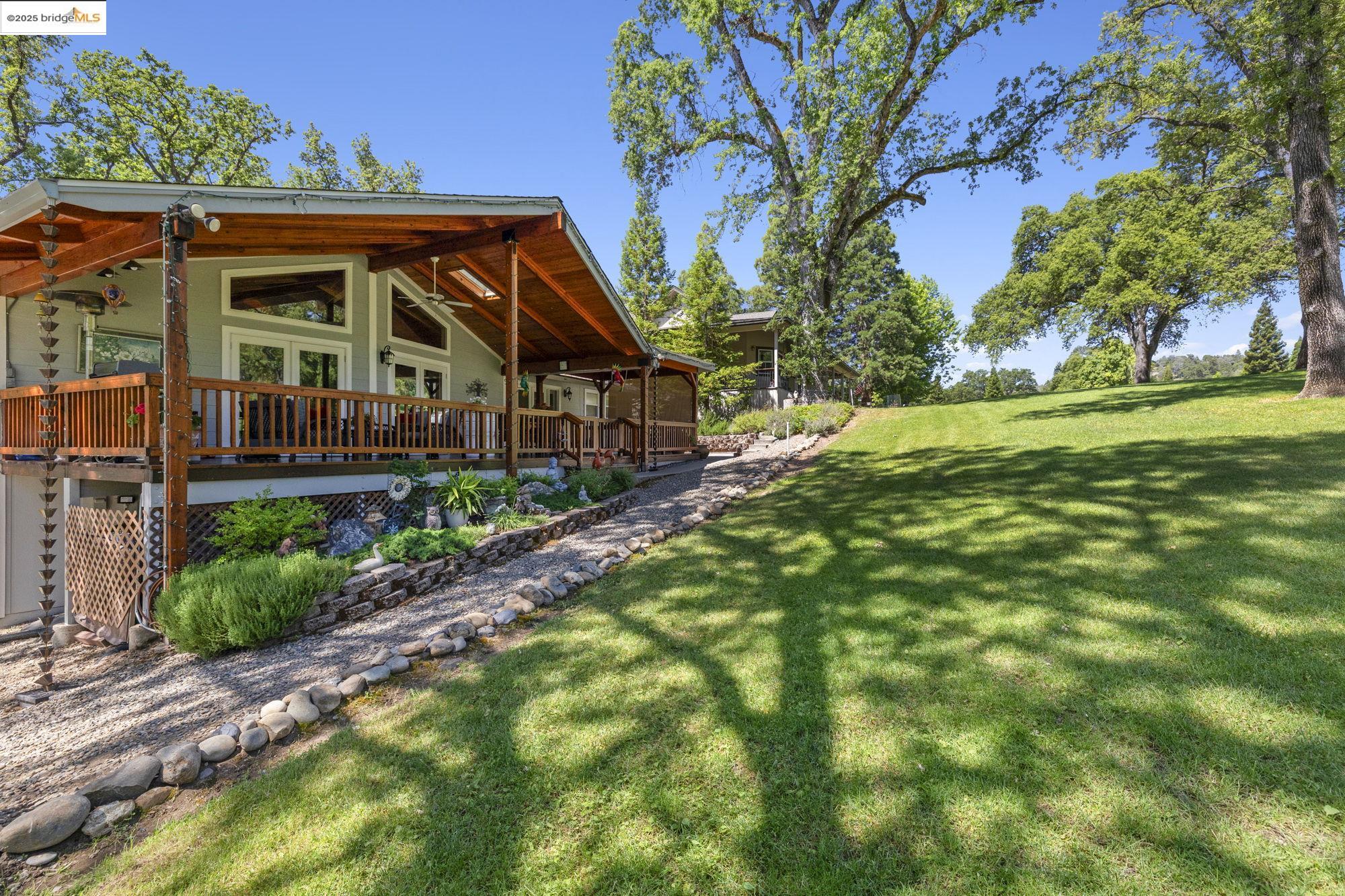 19400 Reid Circle Groveland, CA 95321 - Photo 8 of 60 a front view of a house with a yard