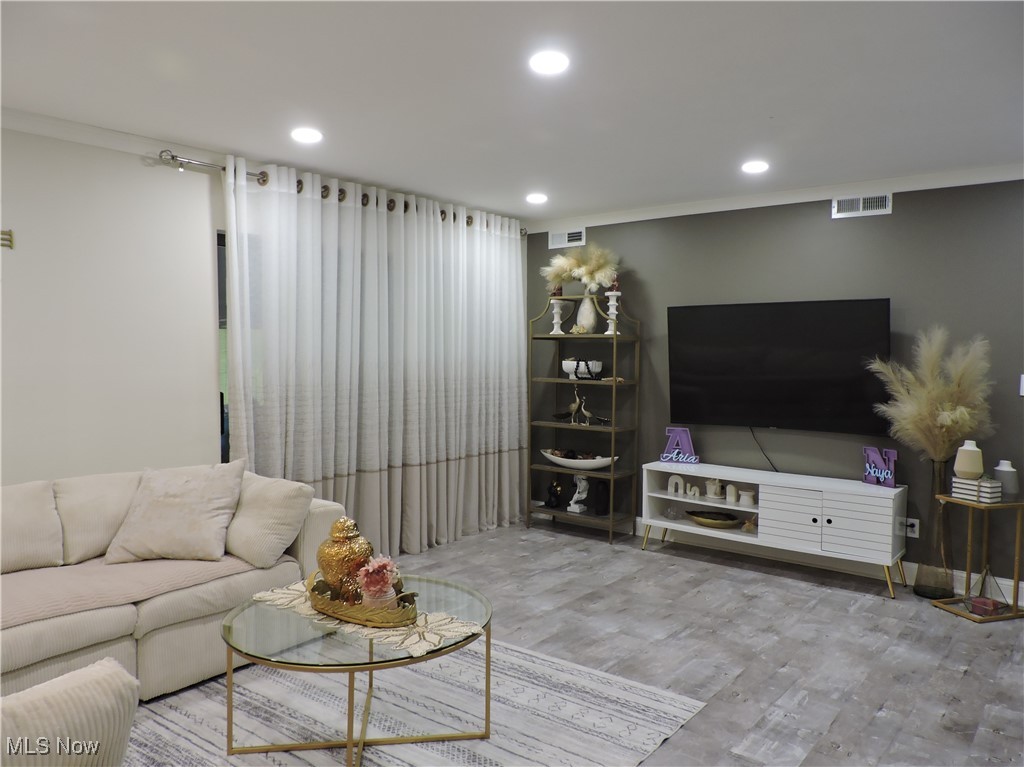 22958 Maple Ridge Road, Unit 205 North Olmsted, OH 44070 - Photo 5 of 28 Living room featuring laminate floors and recessed lighting