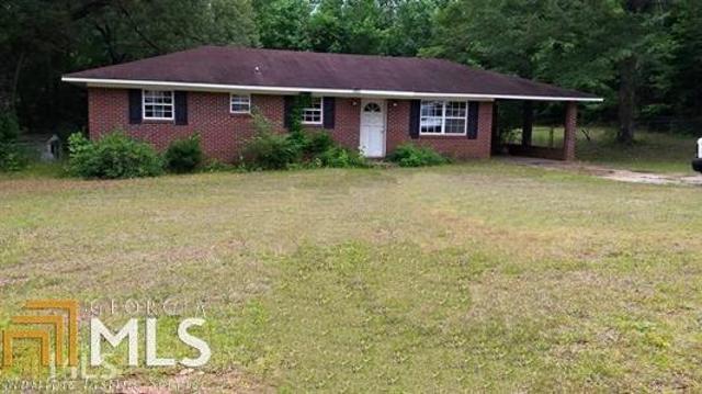 3327 Hopewell Road Valley, AL 36854 - Photo 1 of 1 a front view of a house with garden