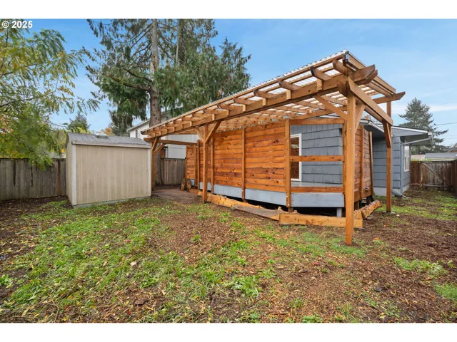 a view of backyard with a garden and stairs