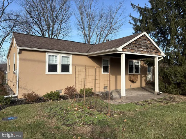 a front view of a house with yard