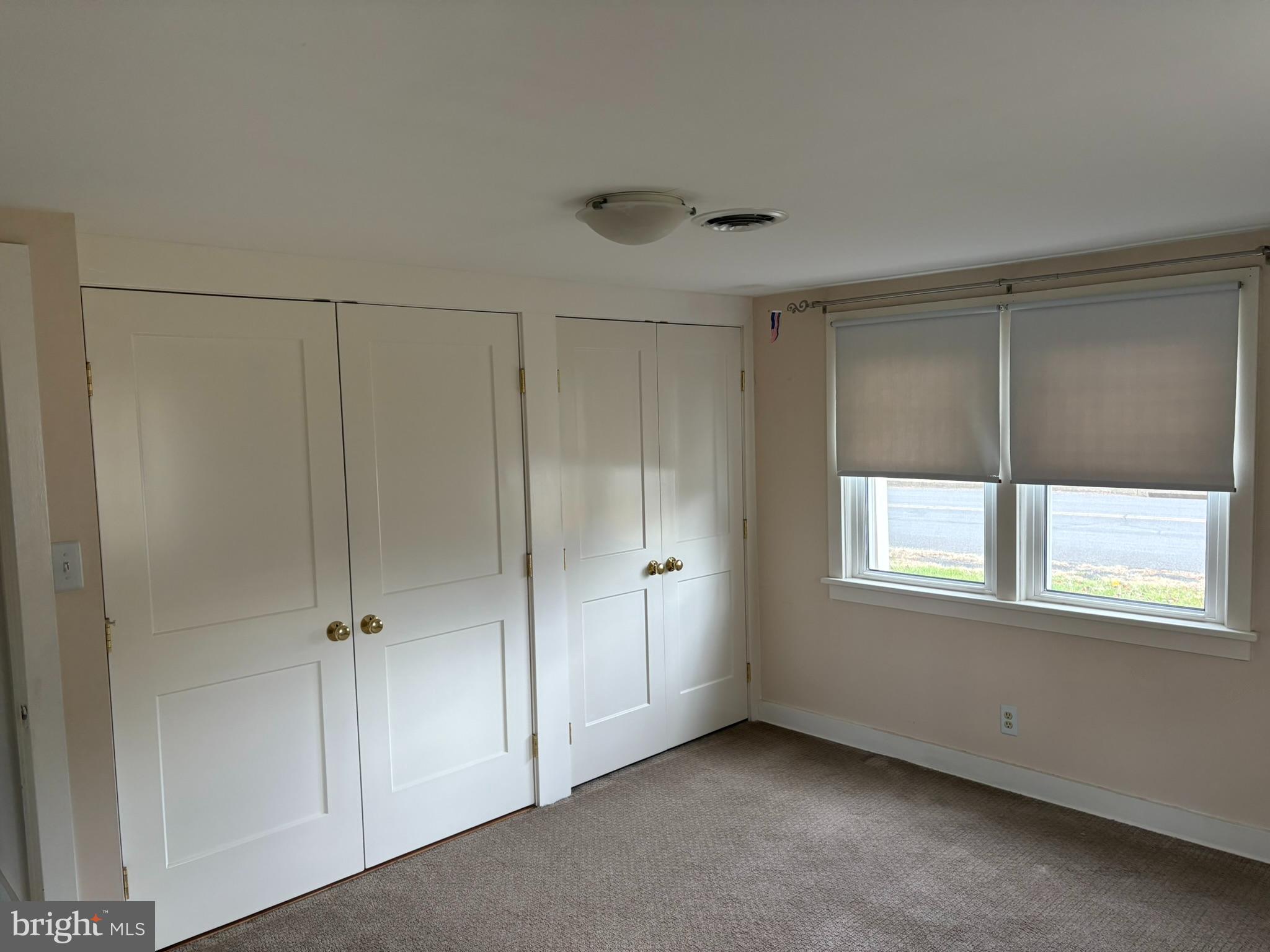 3842 Old Easton Road Doylestown, PA 18902 - Photo 11 of 13 a view of an empty room with a window