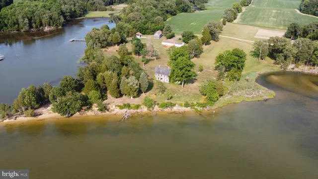 an aerial view of a houses with yard