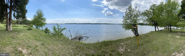 a view of lake with green space