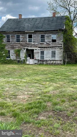 an aerial view of a houses with yard