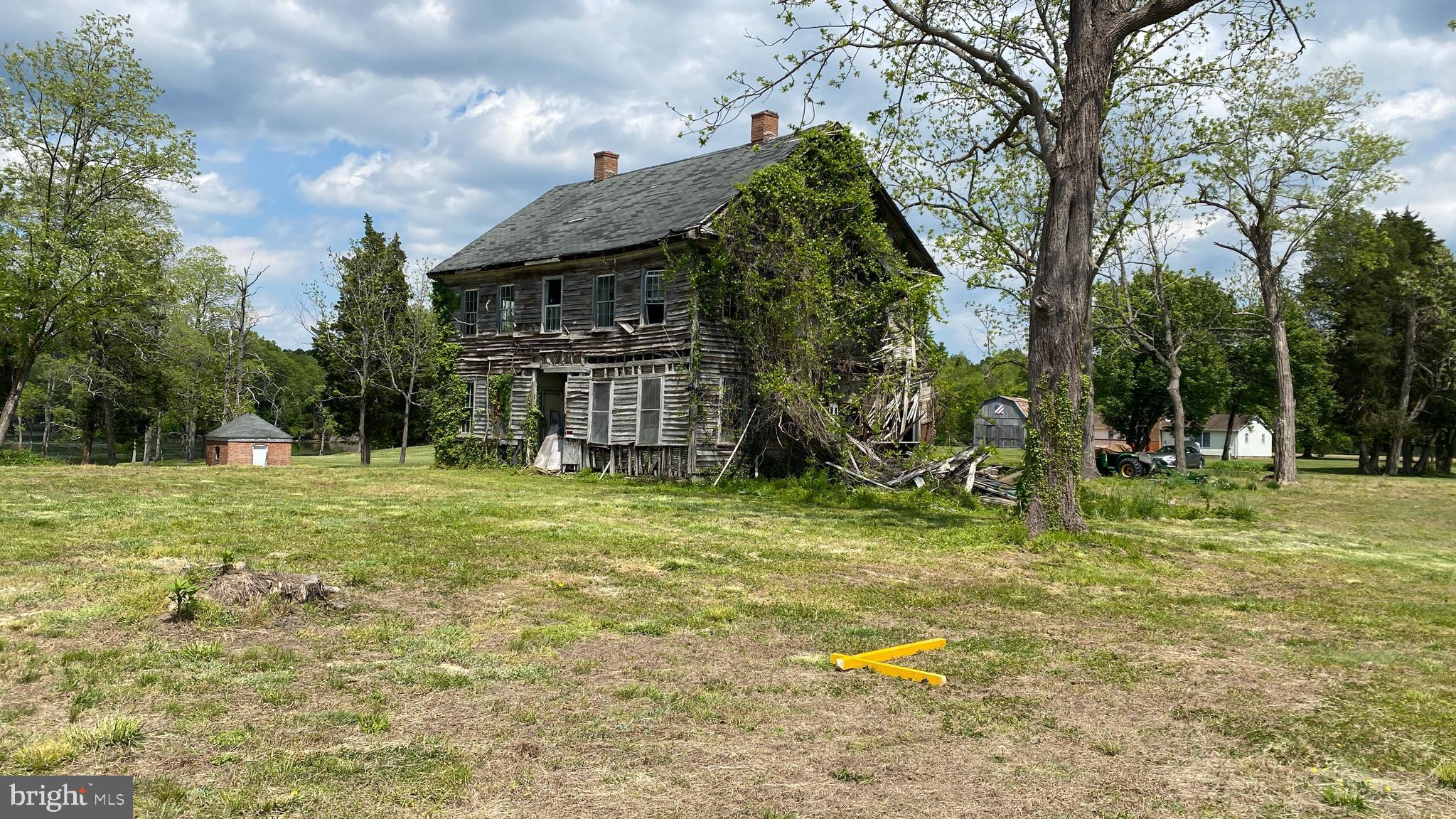 39645 Sweetpea Lane Leonardtown, MD 20650 - Photo 42 of 66 a backyard of a house with swimming pool and big trees
