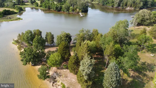 an aerial view of a residential houses with outdoor space