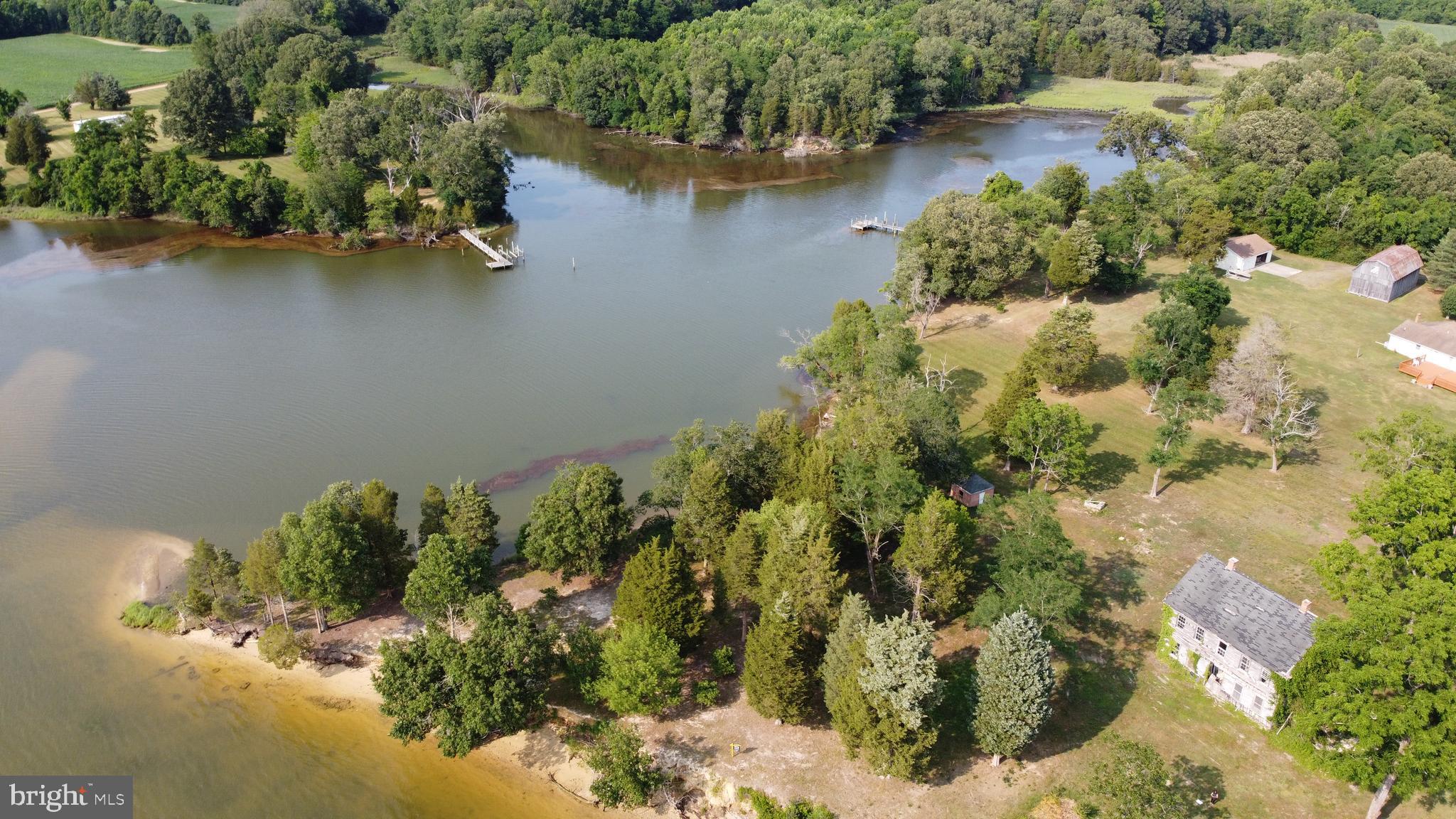39645 Sweetpea Lane Leonardtown, MD 20650 - Photo 62 of 66 an aerial view of a house with a yard and lake view