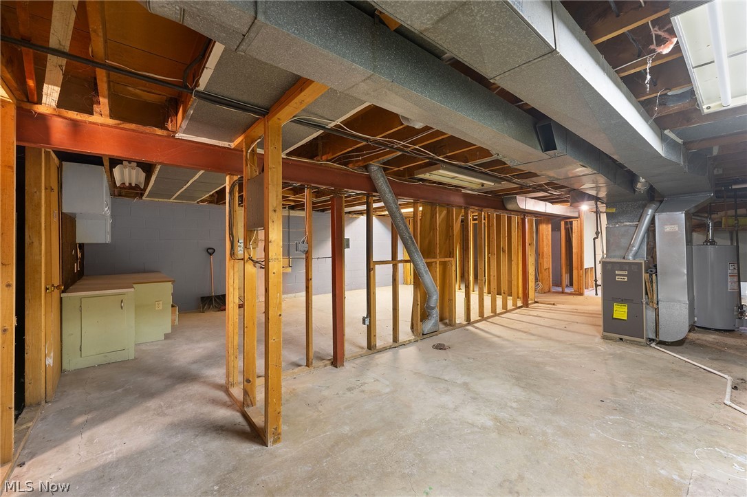 962 Keefer Road Girard, OH 44420 - Photo 25 of 31 Basement with gas water heater and heating utilities