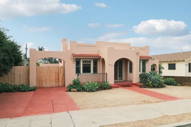 a front view of a house with yard