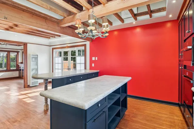 a kitchen with stainless steel appliances granite countertop a refrigerator a sink and a stove