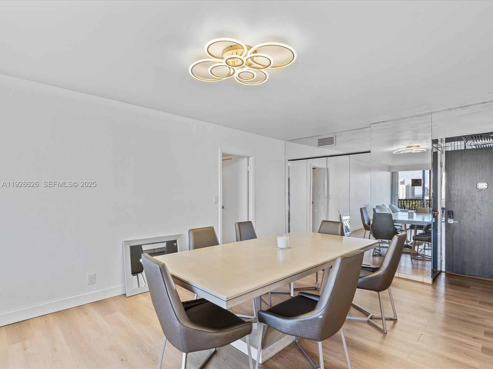 20335 West Country Club Drive, Unit 1608 Aventura, FL 33180 - Photo 12 of 26 a view of a dining room with furniture