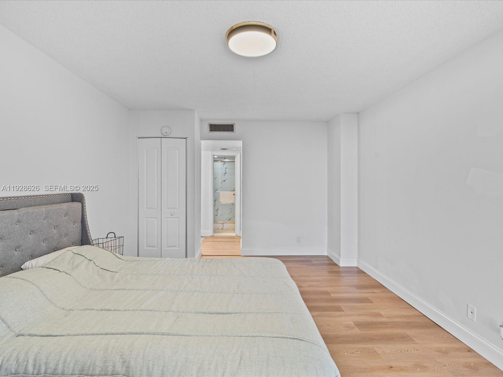 20335 West Country Club Drive, Unit 1608 Aventura, FL 33180 - Photo 17 of 26 a bedroom with a bed and window