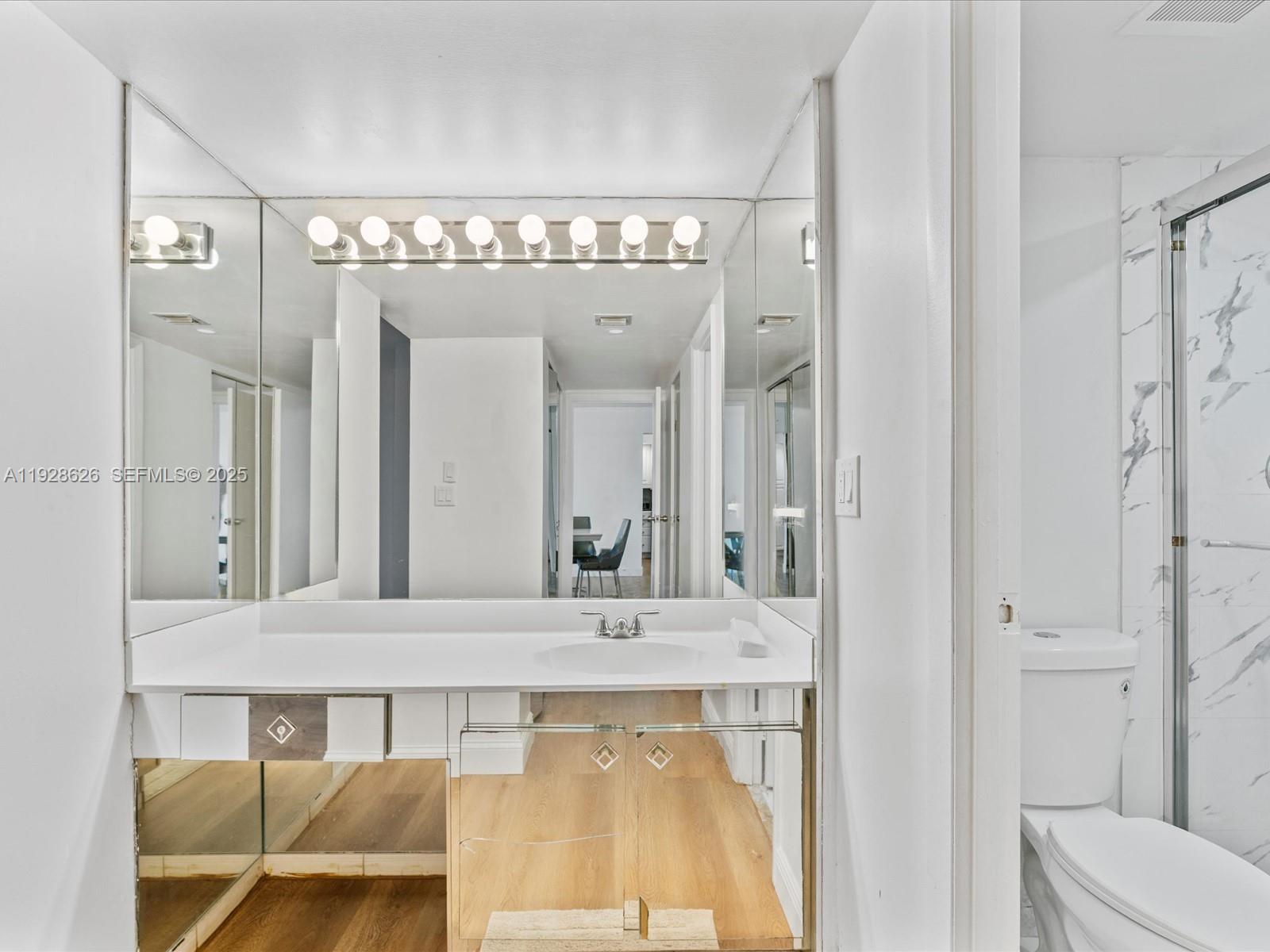 20335 West Country Club Drive, Unit 1608 Aventura, FL 33180 - Photo 18 of 26 a bathroom with a sink and a mirror