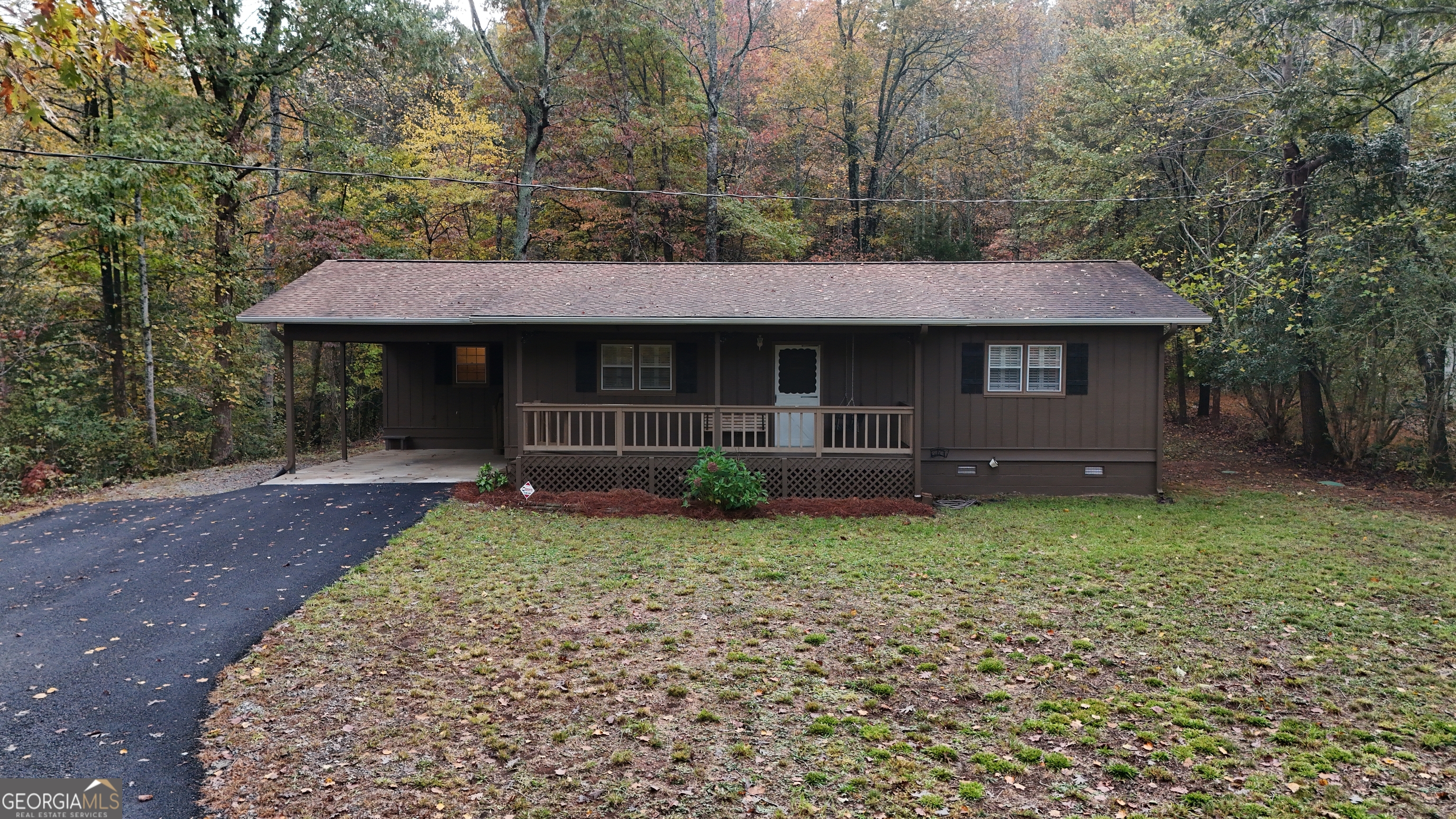 182 Stovall Road Cleveland, GA 30528 - Photo 1 of 1 a front view of a house with garden