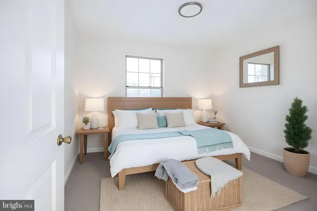 a bedroom with a bed and window