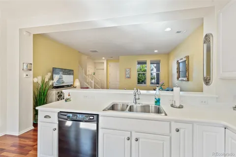 a kitchen with a sink cabinets and window