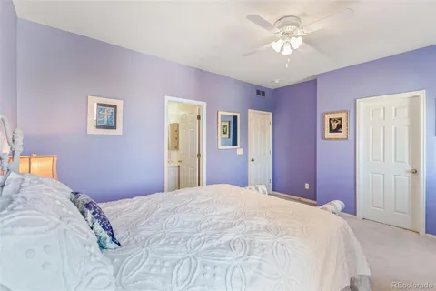 a bedroom with a large bed and closet