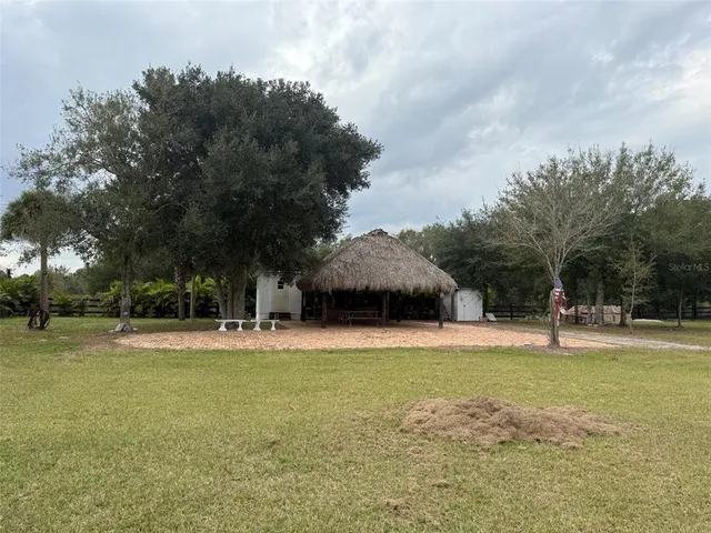 a view of swimming pool and trees in the background