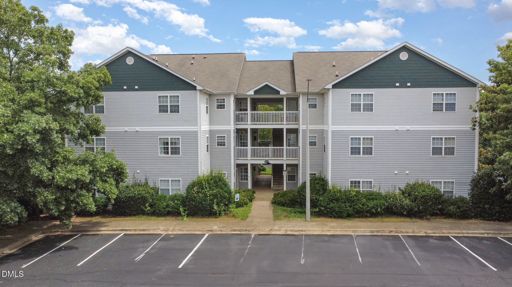 2011 Wolfmill Drive, Unit 301 Raleigh, NC 27603 - Photo 2 of 12 a front view of a house with a yard