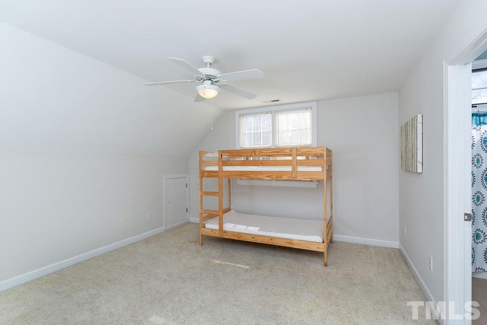 4401 Irene Way Raleigh, NC 27603 - Photo 13 of 30 Vaulted ceiling in bedroom 3 w/ closet and direct access to the full bath.