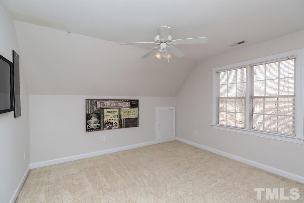 4401 Irene Way Raleigh, NC 27603 - Photo 15 of 30 Vaulted ceiling in bedroom 2 w/ closet.