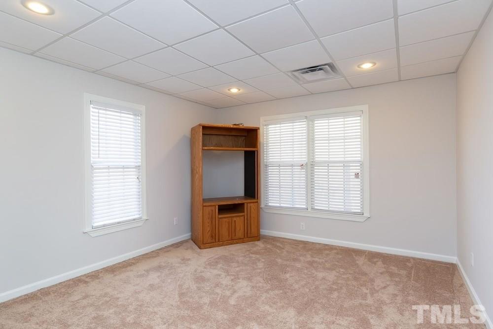 4401 Irene Way Raleigh, NC 27603 - Photo 20 of 30 Additional lower level toom with tons of windows for additional light, could be playroom.