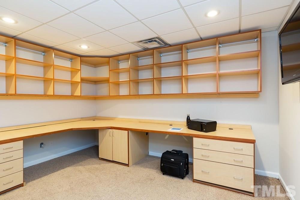 4401 Irene Way Raleigh, NC 27603 - Photo 22 of 30 Lower Level Office w/desk and built in shelving.
