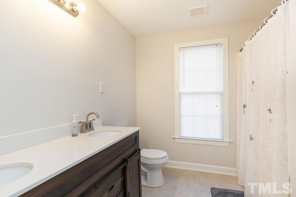 4401 Irene Way Raleigh, NC 27603 - Photo 23 of 30 Lower Level Full Bath w/tub/shower.