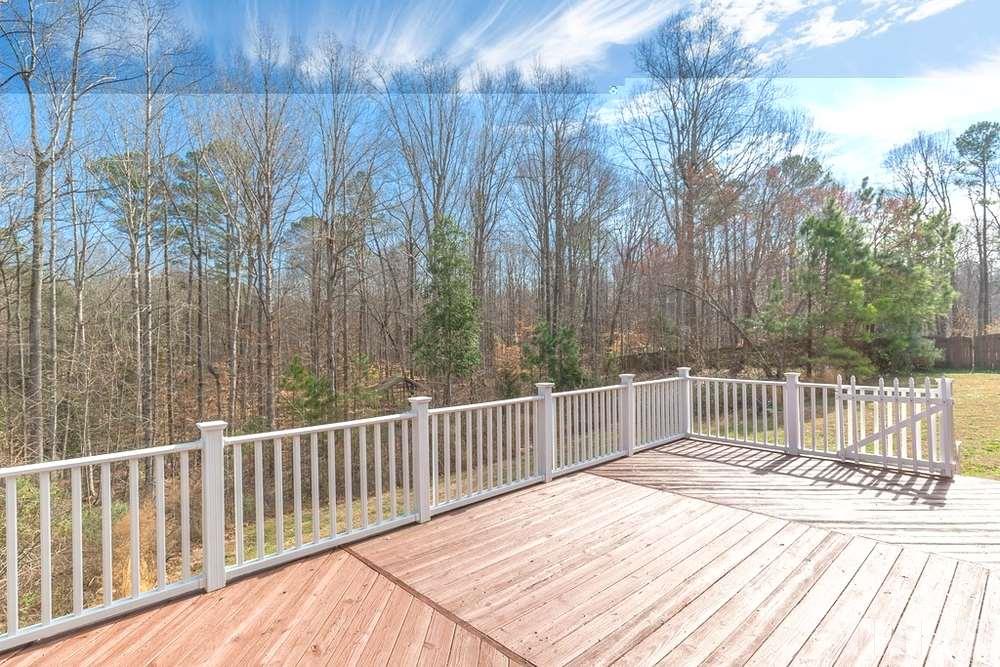 4401 Irene Way Raleigh, NC 27603 - Photo 26 of 30 Large back deck overlooking wooded private backyard.