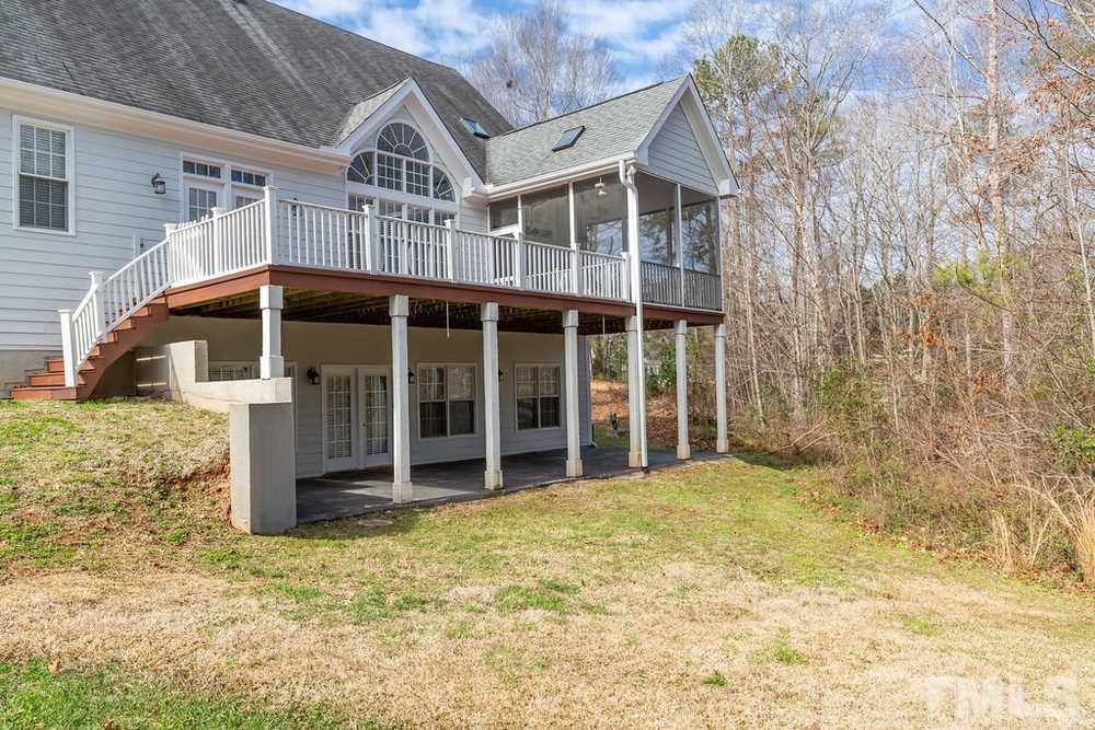 4401 Irene Way Raleigh, NC 27603 - Photo 27 of 30 View of the back of the house with the Screen Porch, Deck, and Lower Level Deck.