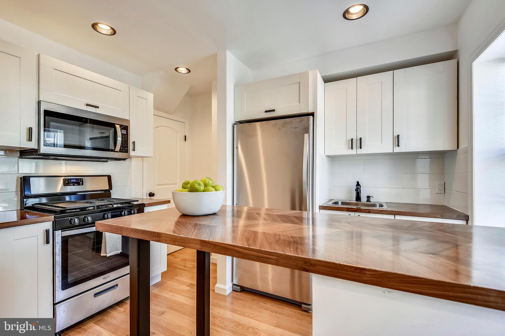 3422 Roland Avenue Baltimore, MD 21211 - Photo 13 of 34 Large Island in Kitchen with Walnut Countertops