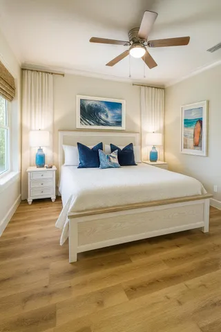 a spacious bedroom with a large bed and a chandelier