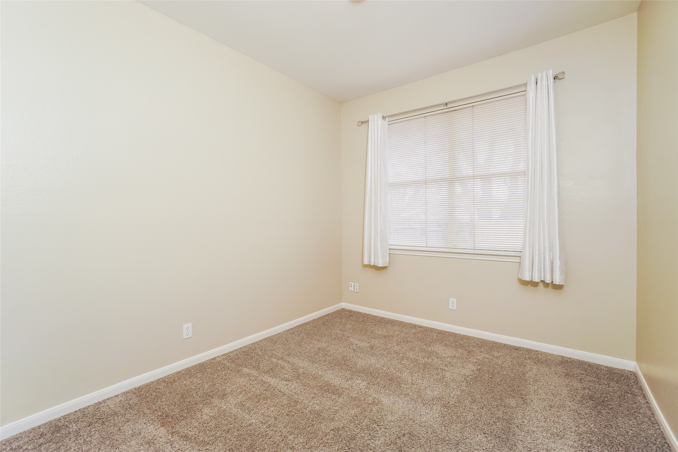 2403 Curry Loop Round Rock, TX 78664 - Photo 12 of 16 Spare room with baseboards and carpet