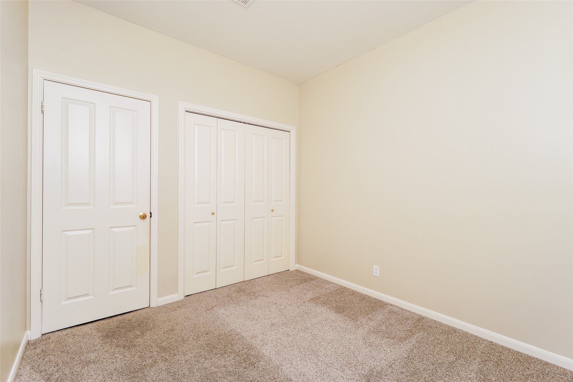 2403 Curry Loop Round Rock, TX 78664 - Photo 13 of 16 Unfurnished bedroom featuring carpet floors and a closet