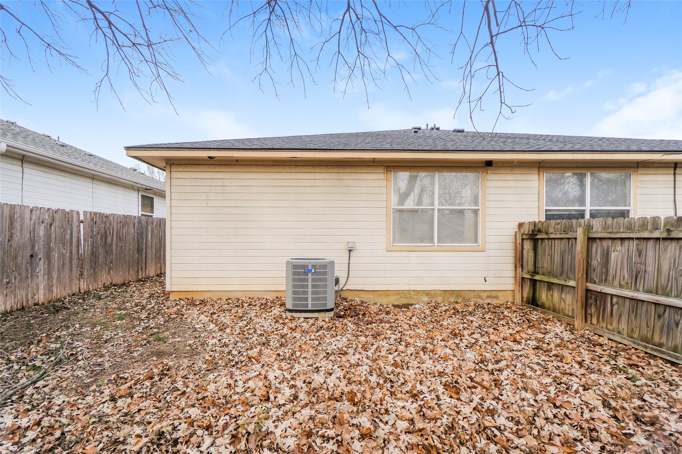2403 Curry Loop Round Rock, TX 78664 - Photo 15 of 16 Back of house featuring a fenced backyard and a shingled roof