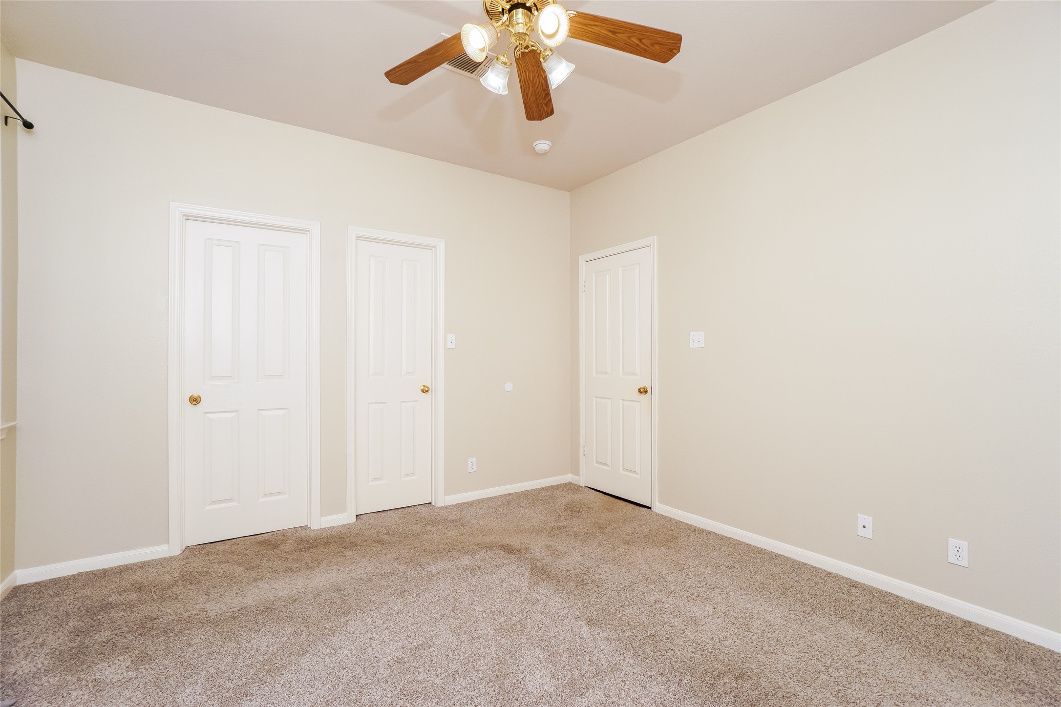 2403 Curry Loop Round Rock, TX 78664 - Photo 8 of 16 Unfurnished bedroom featuring carpet and a ceiling fan