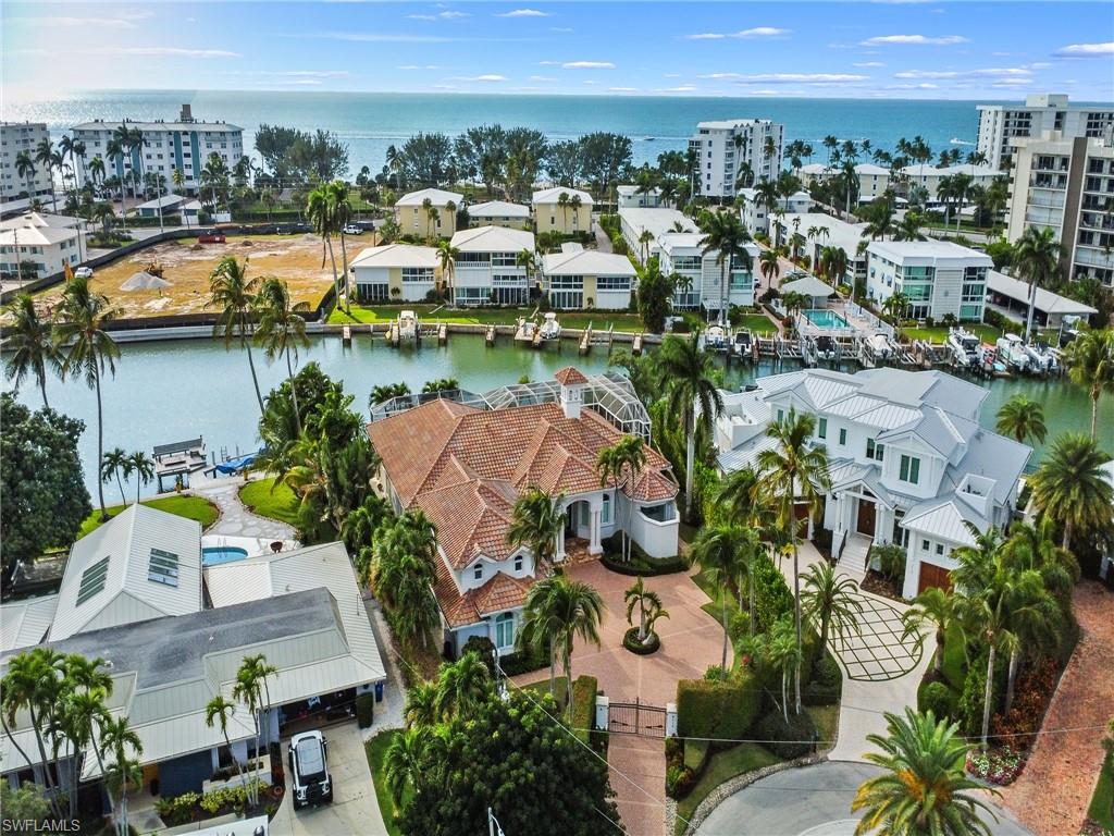 216 Springline Drive Naples, FL 34102 - Photo 13 of 46 Drone / aerial view of a nearby body of water