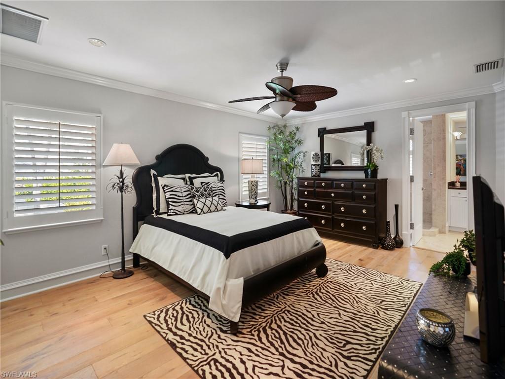 216 Springline Drive Naples, FL 34102 - Photo 32 of 46 Bedroom featuring light wood-type flooring, ornamental molding, and a ceiling fan