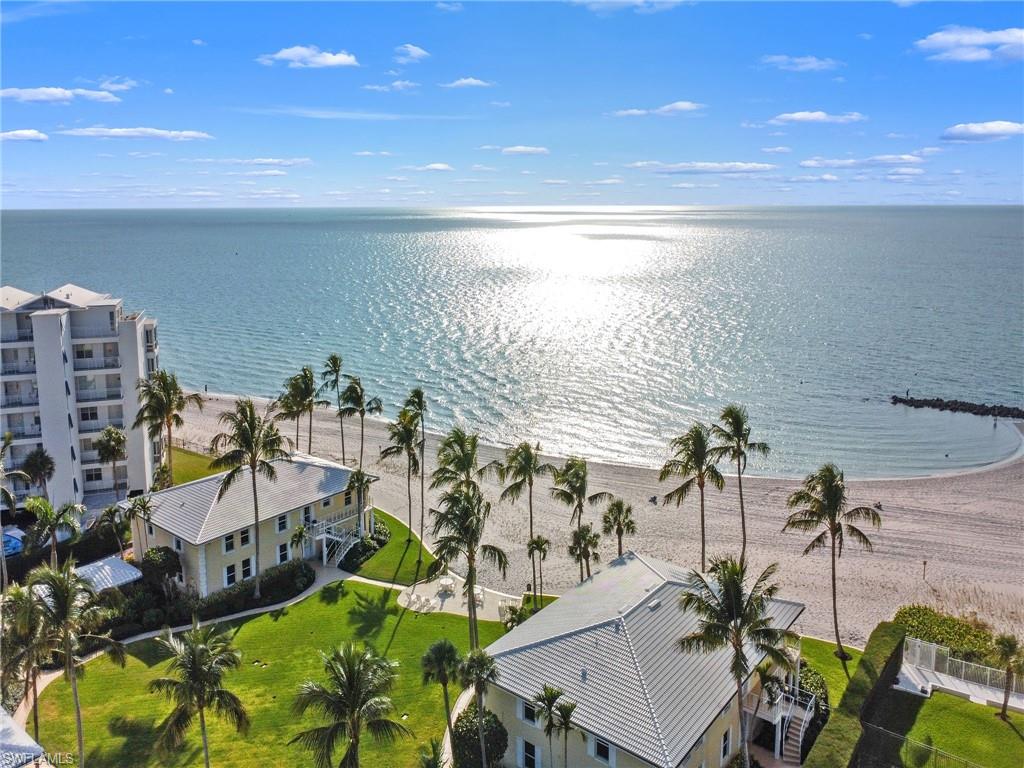 216 Springline Drive Naples, FL 34102 - Photo 44 of 46 Drone / aerial view of a nearby body of water
