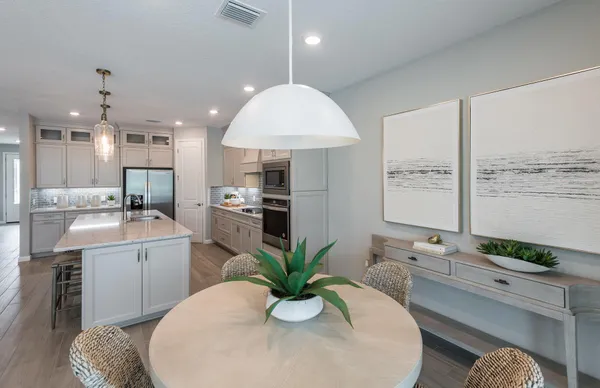 a bathroom with a double vanity sink a mirror and shower
