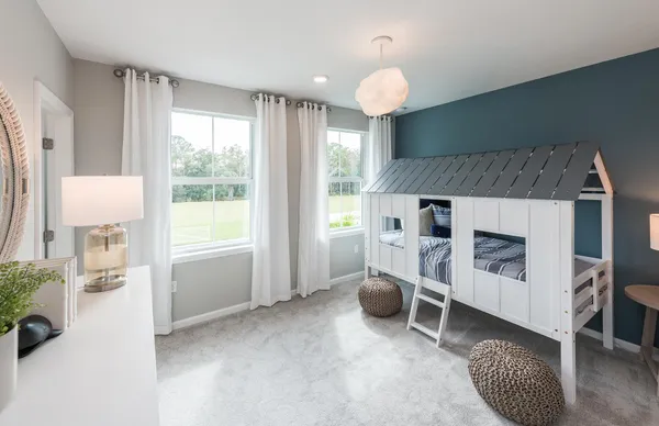 a kitchen with kitchen island granite countertop a sink a counter top space and living room view
